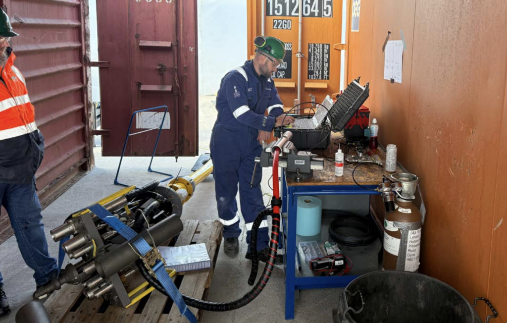 J+S Subsea engineer performing diagnostics and testing on subsea control system equipment during offshore operational support activities.
